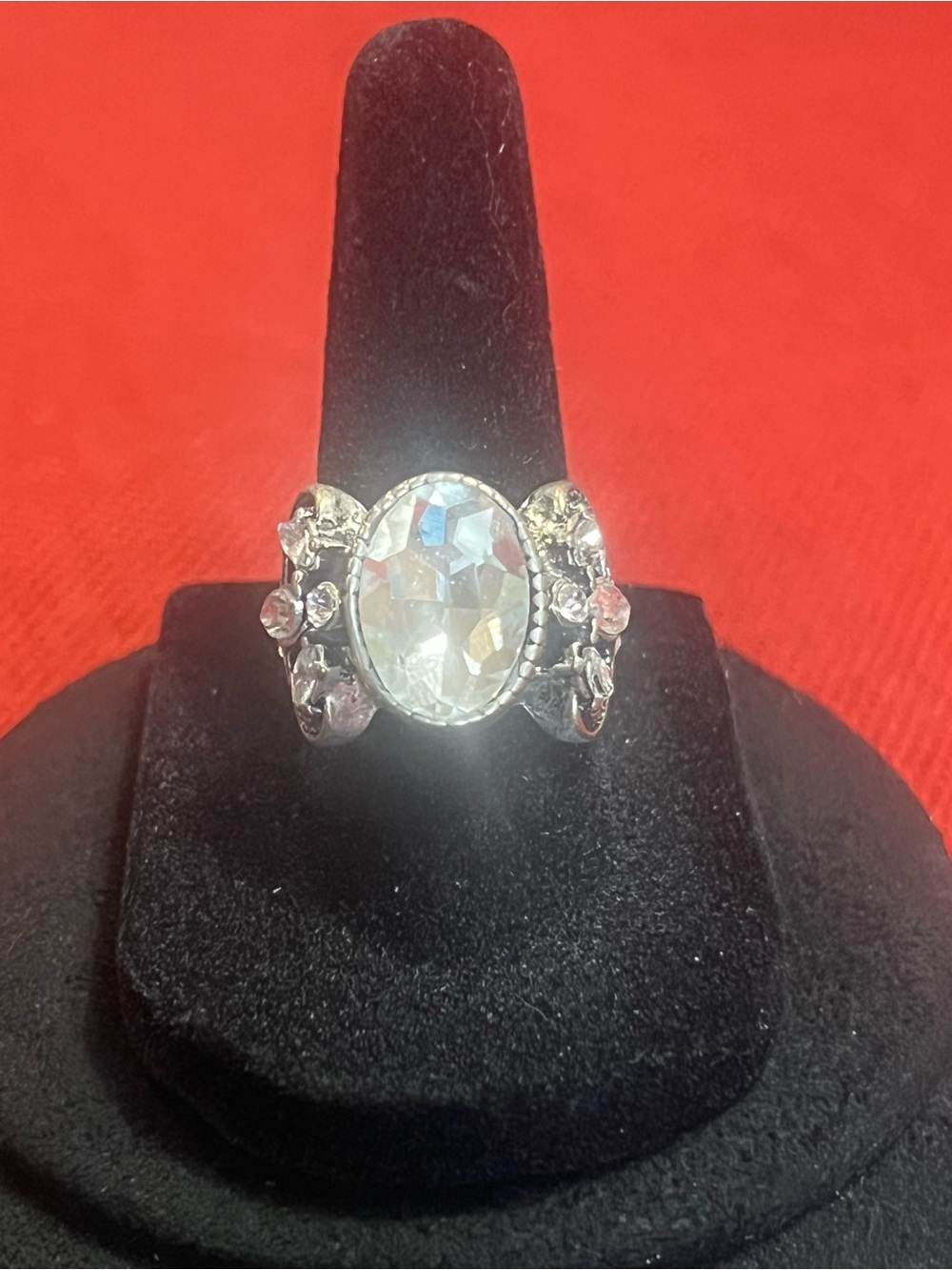 Silver-Tone Ring with Clear Oval Stone and Floral Accents